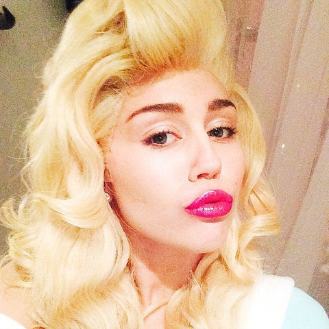Miley Cyrus as Dolly Parton
