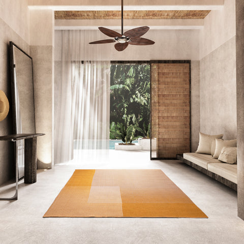 A small area rug in an airy room