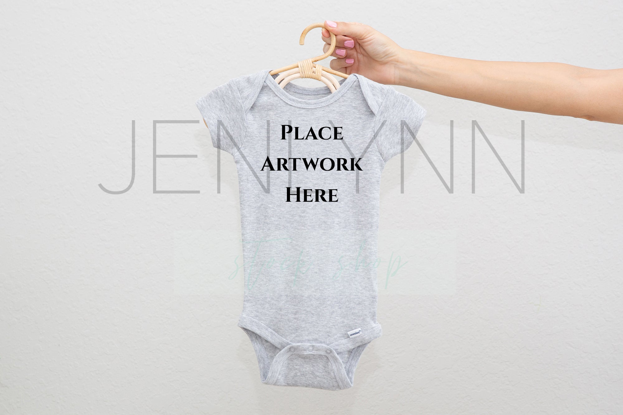 Download Woman Holding White Onesie On Hanger Mockup 4 Jpg Jenlynn Stock Shop