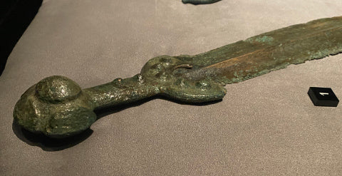 Side view of bronze sword hilt