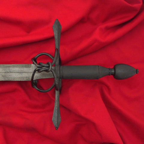 Complex hilted sword done with a dark russet finish, back guard shown with Hercules Knot.