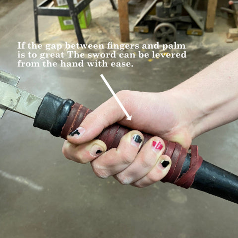 A grip with to large a diameter will allow the sword to be levered from the hand 