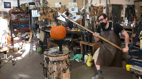 Pumpkin on anvil is threatened by halberd.