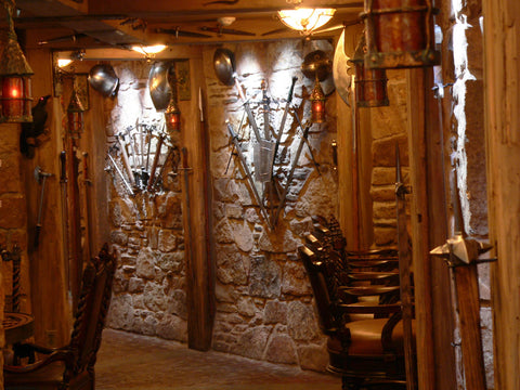 A guard room in domestic castle man cave view across bar down hall.