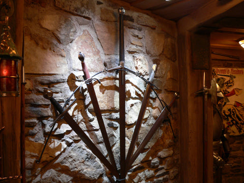 A guard room in domestic castle man cave claymore fan display.