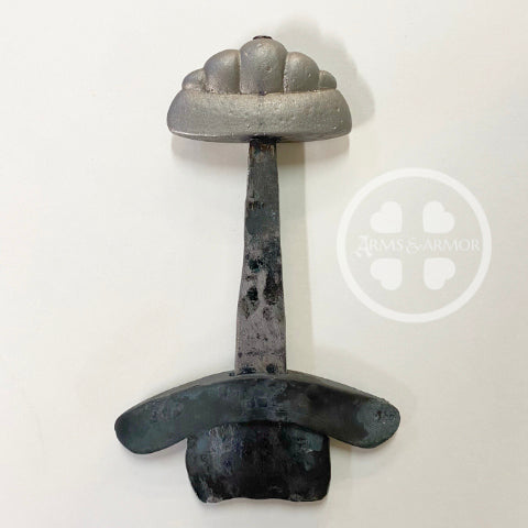 Early medieval sword hilt crafted with iron tang.