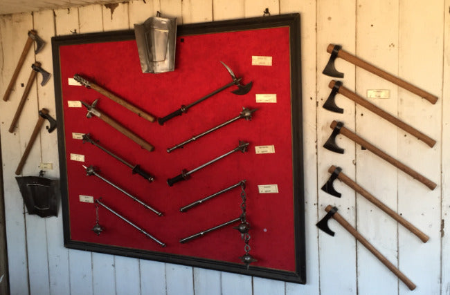 Axe wall at the booth of Arms & Armor Inc.
