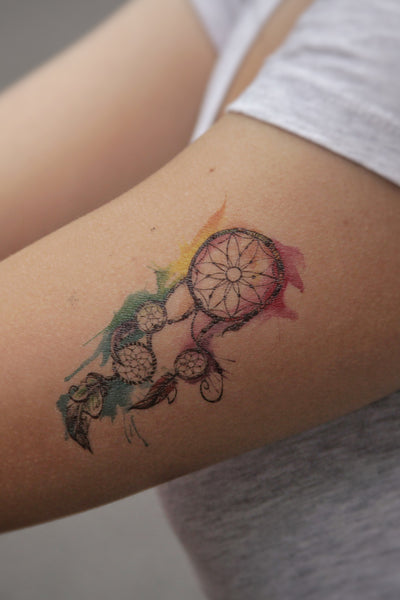 dreamcatcher tattoo on inner arm