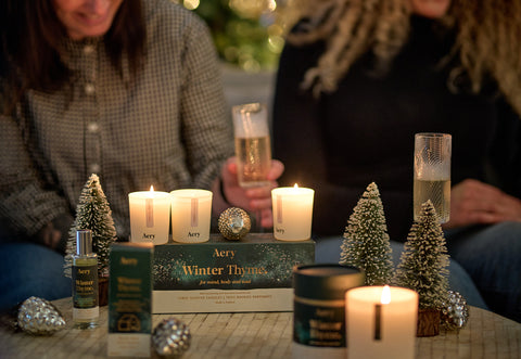 festive setting with lots of candles lit and people in the background