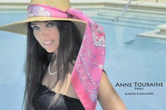 Pink scarf by ANNE TOURAINE Paris™ over a straw hat