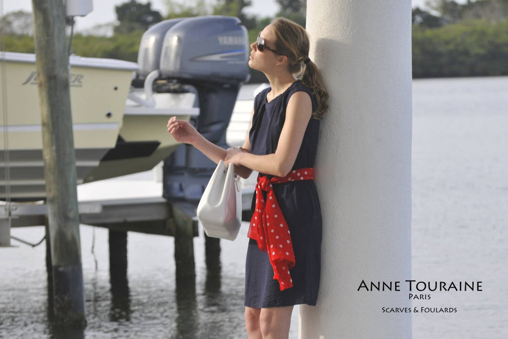 Chiffon silk scarves by ANNE TOURAINE Paris™: red polka dot scarf tied as along belt