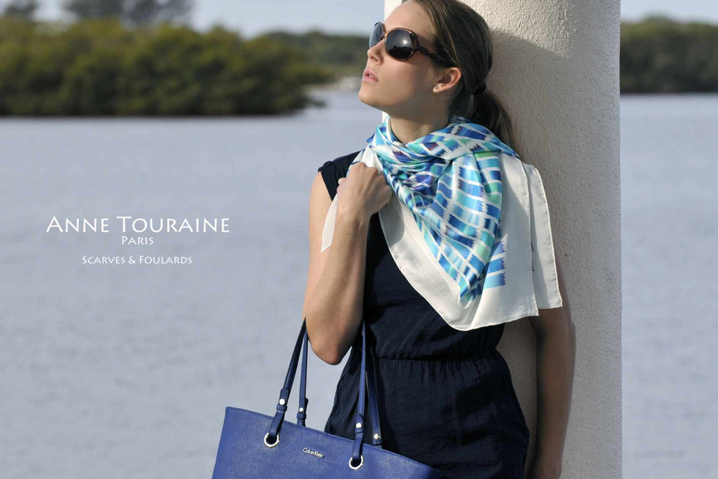 Extra large silk scarves by ANNE TOURAINE Paris™: blue and white silk satin scarf tied as a shoulder wrap and tilted to the side