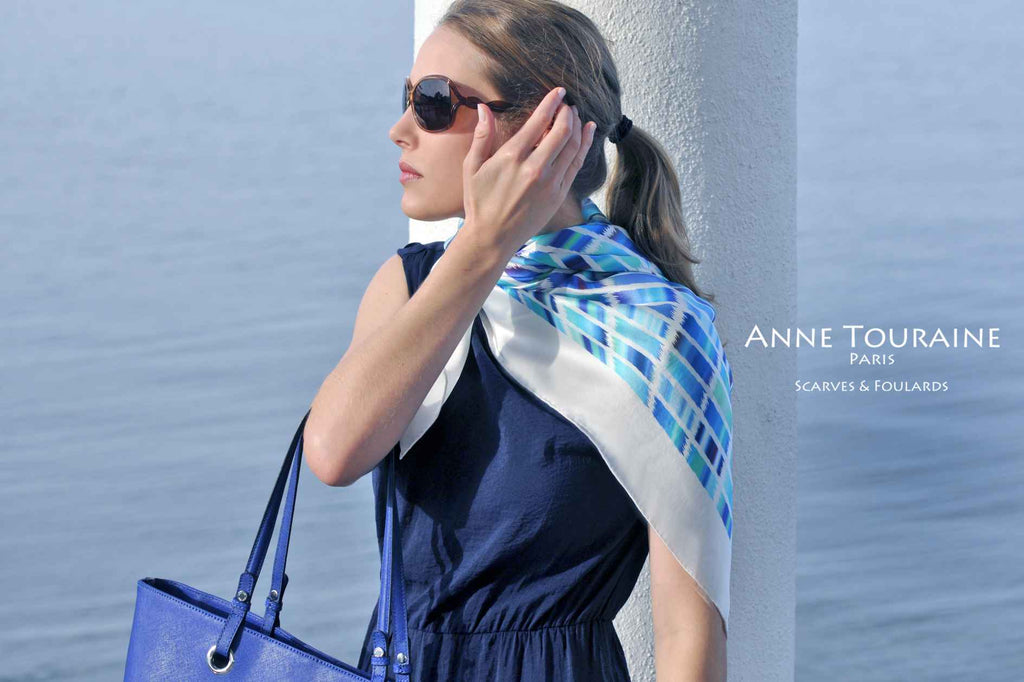 Extra large silk scarves by ANNE TOURAINE Paris™: blue and white silk satin scarf tied as a half shoulder wrap