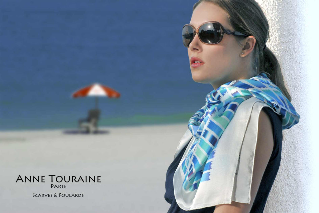Extra large silk scarves by ANNE TOURAINE Paris™: blue and white silk satin scarf tied as a loose shoulder wrap