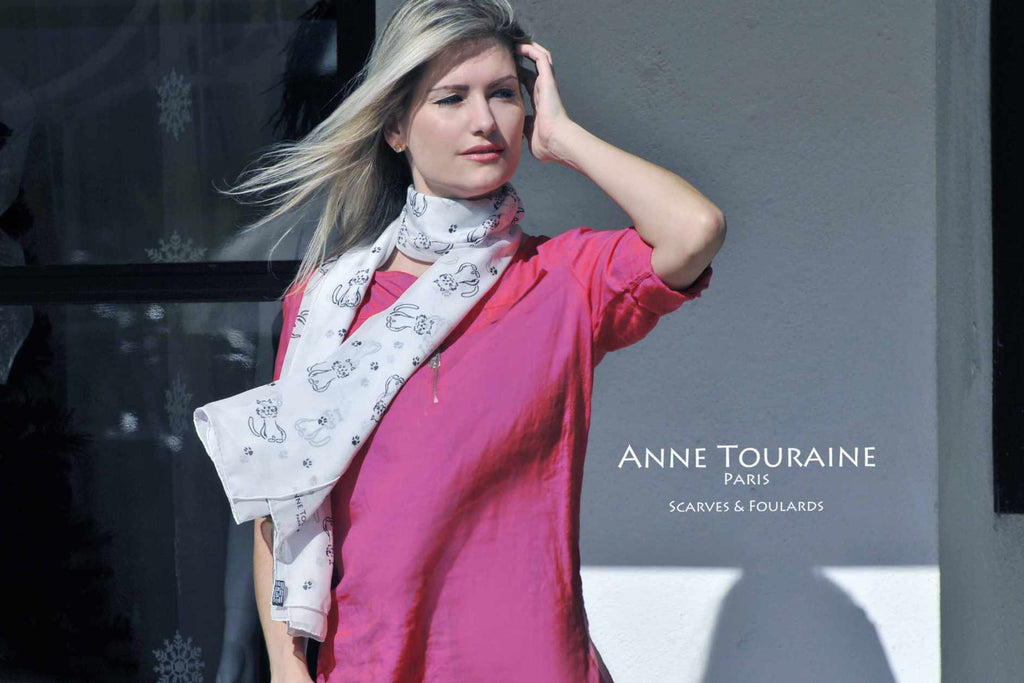 Chiffon silk scarves by ANNE TOURAINE Paris™: light grey cat pattern scarf wrapped twice around the neck and hanging loose to the front