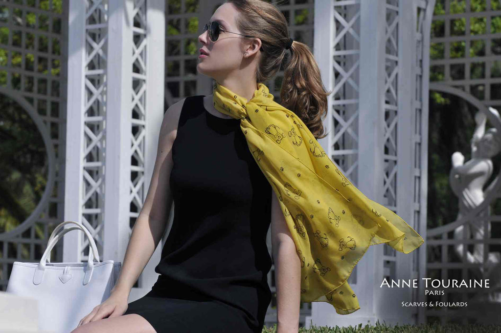 Chiffon silk scarves by ANNE TOURAINE Paris™: yellow dog pattern tied at the side of the neck