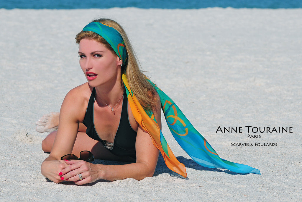 Extra large silk chiffon scarves by ANNE TOURAINE Paris™: teal and orange scarf tied in the hair as a long headband