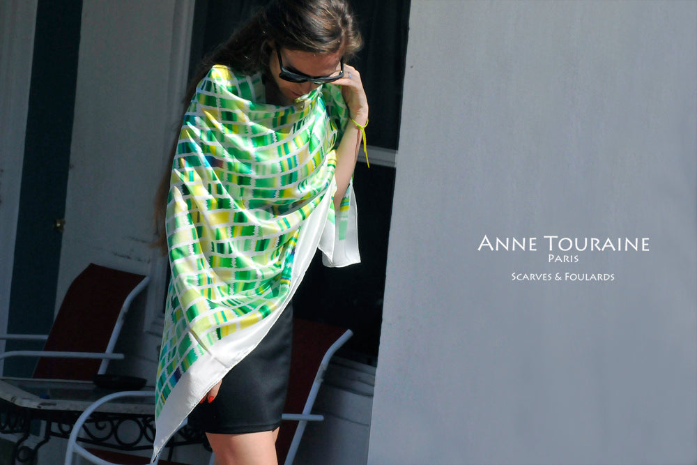 Extra large silk scarves by ANNE TOURAINE Paris™: green and yellow silk satin scarf tied as a large shoulder wrap