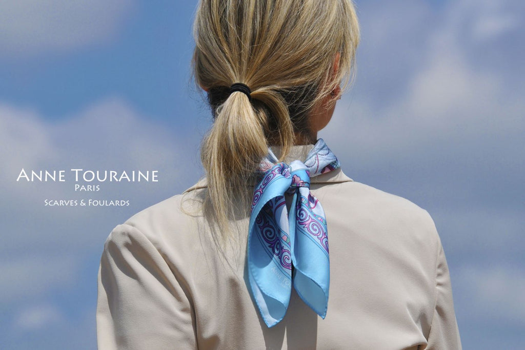 French silk scarves by ANNE TOURAINE Paris™: China inspired neon blue scarf tied at the back of the neck