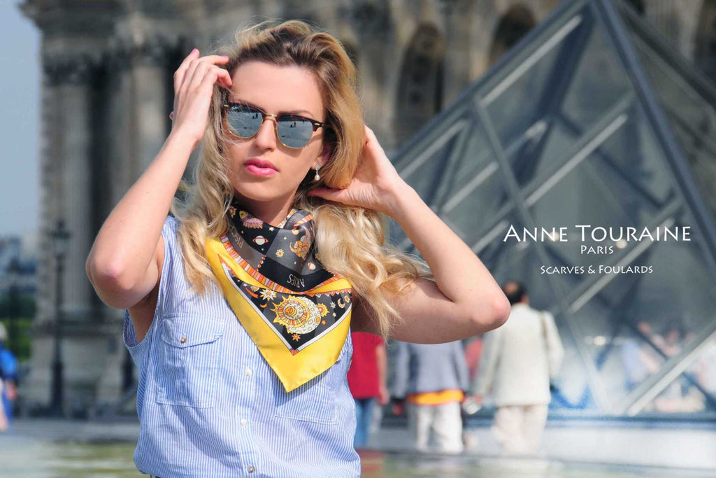 French silk scarves, Astrology and Zodiac design in yellow and black color, by ANNE TOURAINE Paris™, tied as a neck bandana