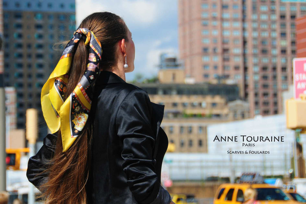 French silk scarves, Astrology and Zodiac design in yellow and black color, by ANNE TOURAINE Paris™, tied on a ponytail