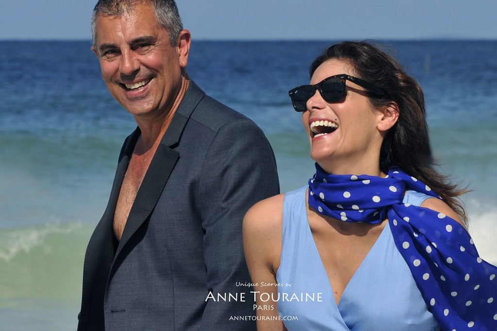 Chiffon silk scarves by ANNE TOURAINE Paris™: blue polka dot scarf loose tied at the side of the neck