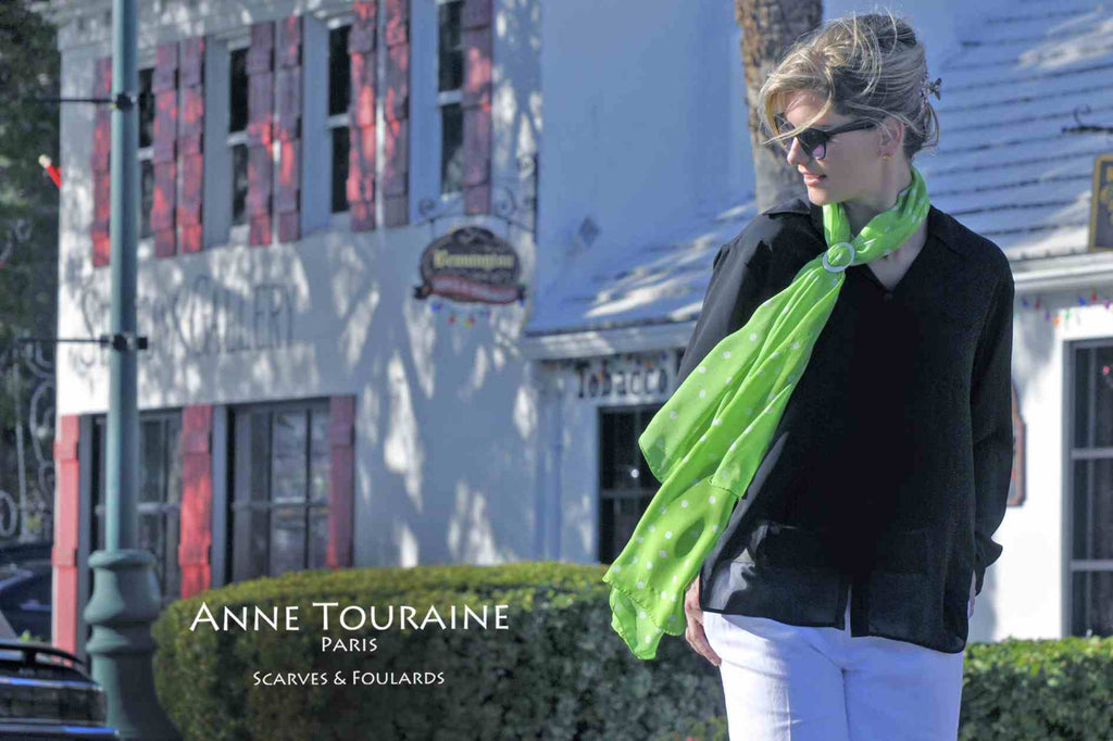 Chiffon silk scarves by ANNE TOURAINE Paris™: green polka dot scarf tied to the front with a white mother of pearl scarf ring