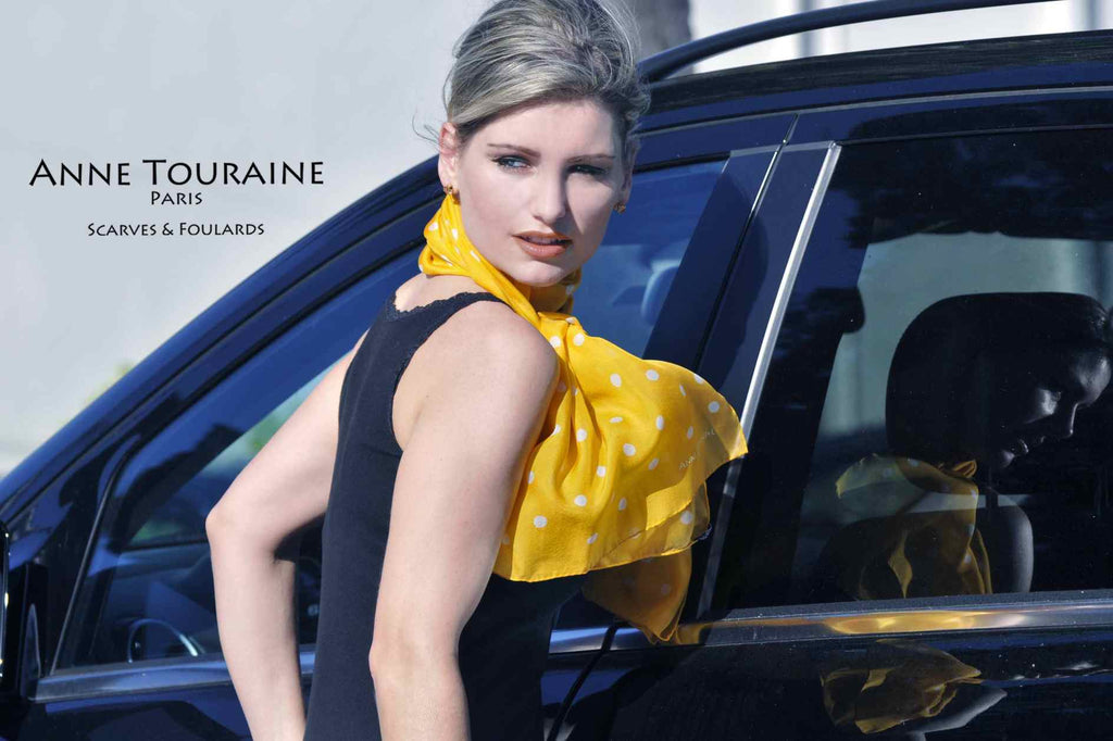 Chiffon silk scarves by ANNE TOURAINE Paris™: orange polka dot scarf wrapped twice around the neck and tied to the front 