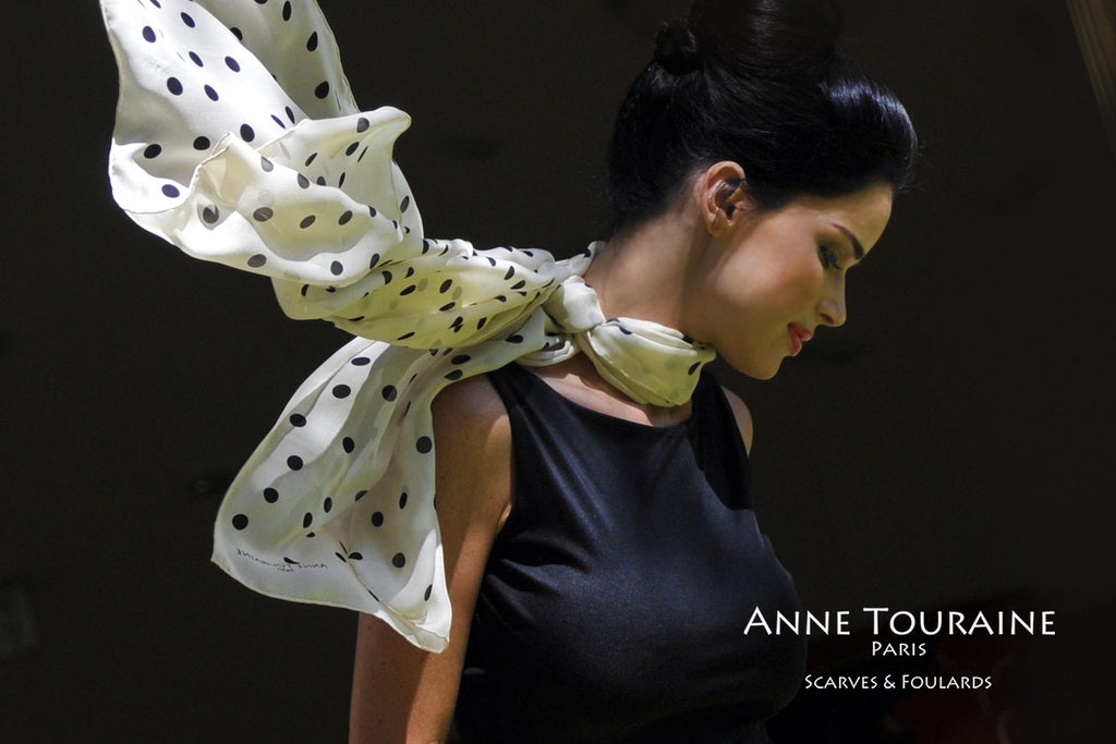 Chiffon silk scarves by ANNE TOURAINE Paris™: champagne polka dot scarf tied on the side of the neck and flowing in the wind