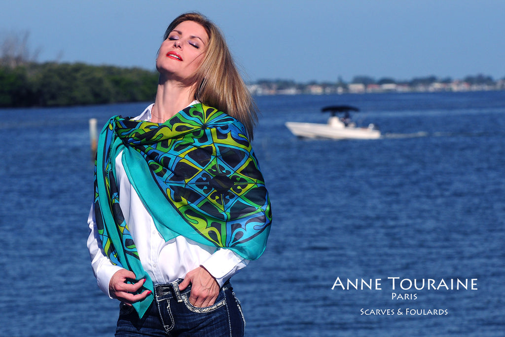 Extra large silk chiffon scarf multicolor around a ponytail Extra large silk chiffon scarves by ANNE TOURAINE Paris™: teal and black scarf as a shoulder wrap