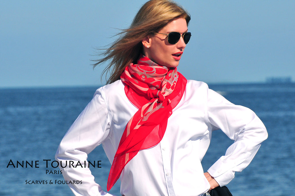 Extra large silk chiffon scarves: red scarf tied at the front of the neck 