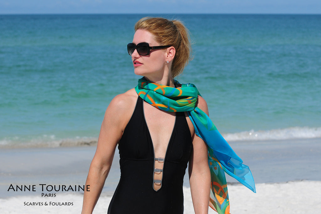 Extra large silk chiffon scarves: teal and orange scarf around the neck and tilted to the side
