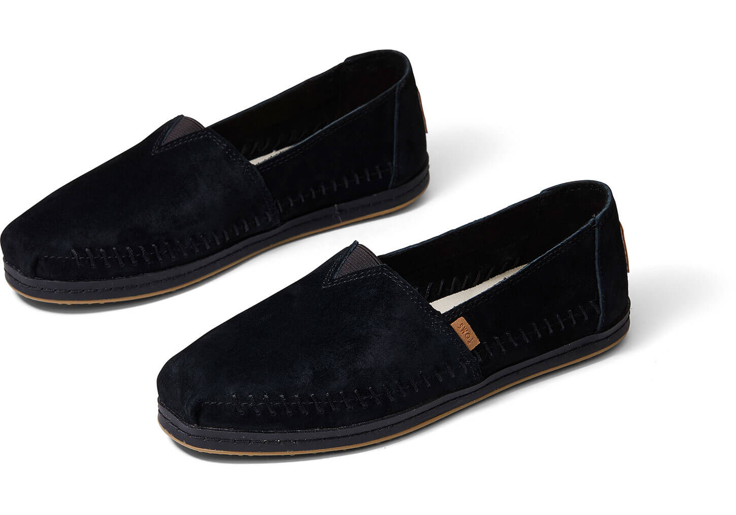 toms black leather slip ons