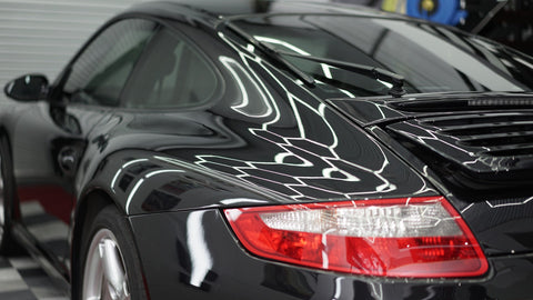 rear side view of porsche carrera 4s at carstudios