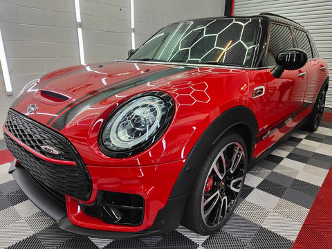 Front Side view of Red JCW clubman cooper at carstudios