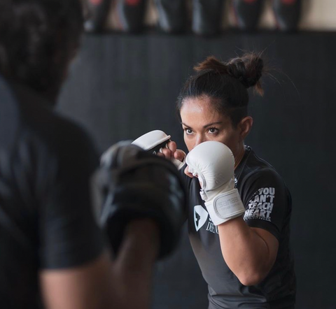 Athlete Miyo Strong practicing boxing.