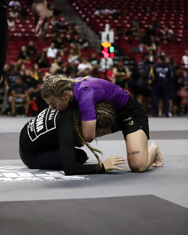 Athlete Sav Wright competing in a No Gi tournament.