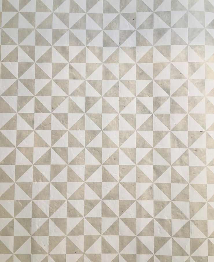 white triangles on cream wrap