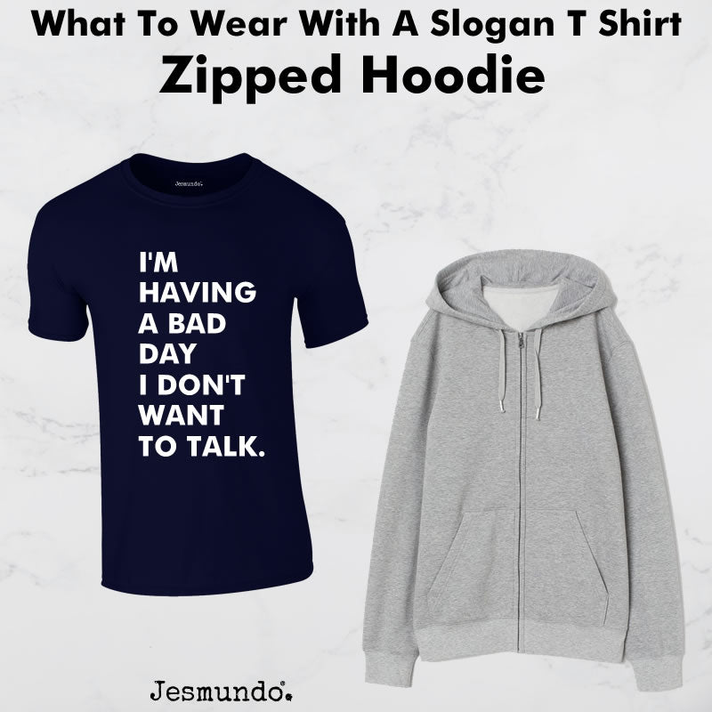 Wearing A Zipped Hoodie With A Slogan T-Shirt