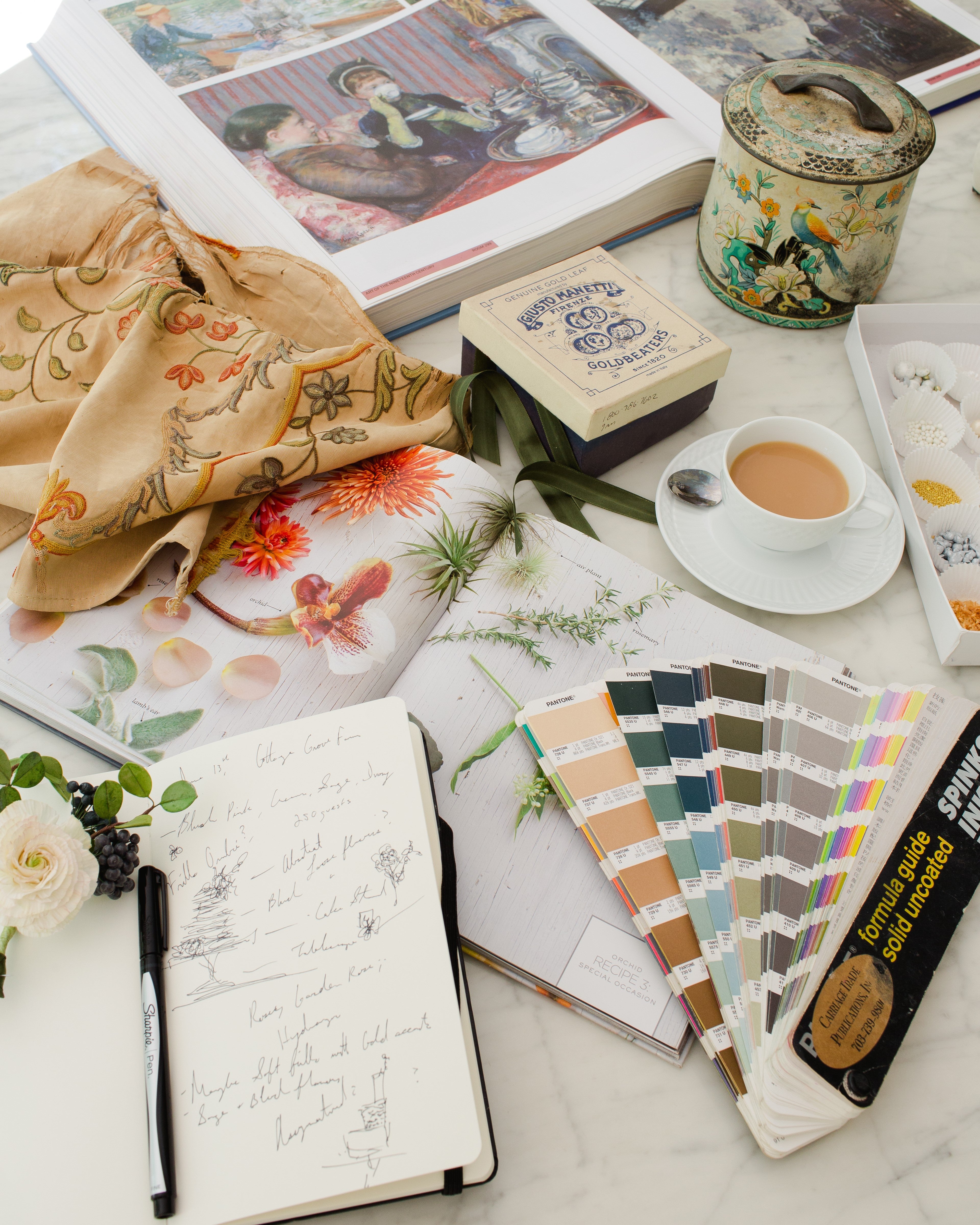 Maggie Austin Design Small Group Mentorship worktable with inspiration books sketches colors tea