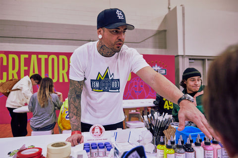 Jonathan Millar of JSM 801 Customs showing off Angelus Products at the NBA Crossover