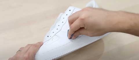 Sanding a Shoe to prep for paint