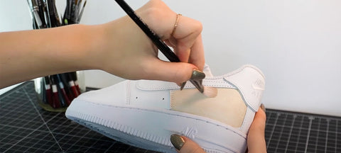 Painting Angelus Paint onto a shoe in thin and light coats