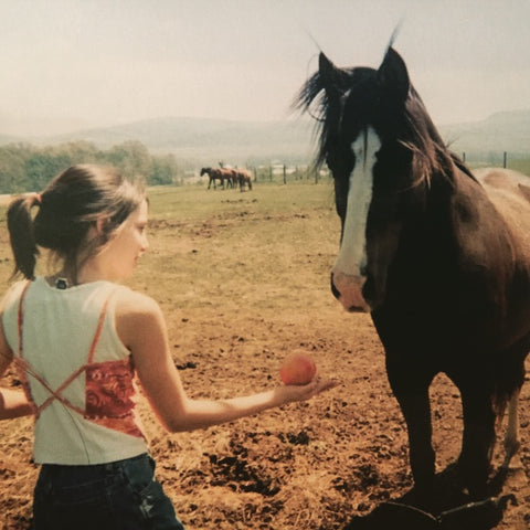 Melissa Dinino as a child with a horse
