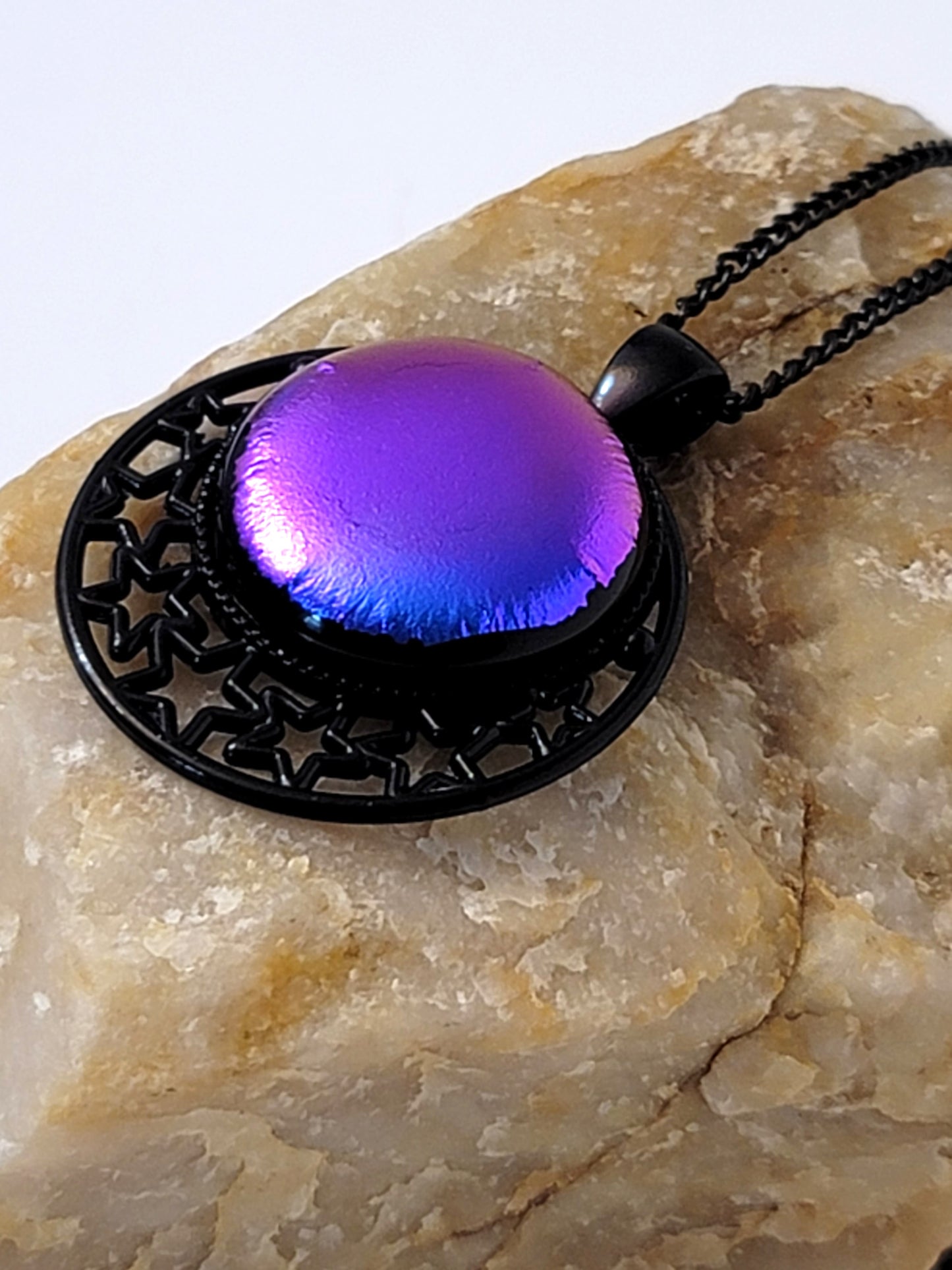 Black Stars Pendant with Purple dichroic glass cabochon on a 20 inch black metal chain.