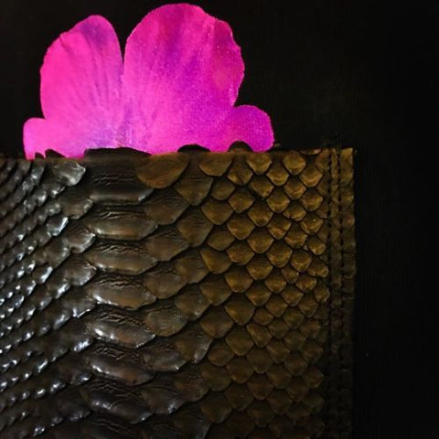 Black Python Leather Skin chest pocket for shirt w/ a printed purple flower slightly sticking out of the pocket.