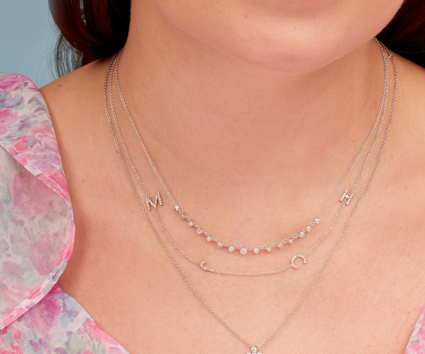 White gold and diamond necklaces on neck