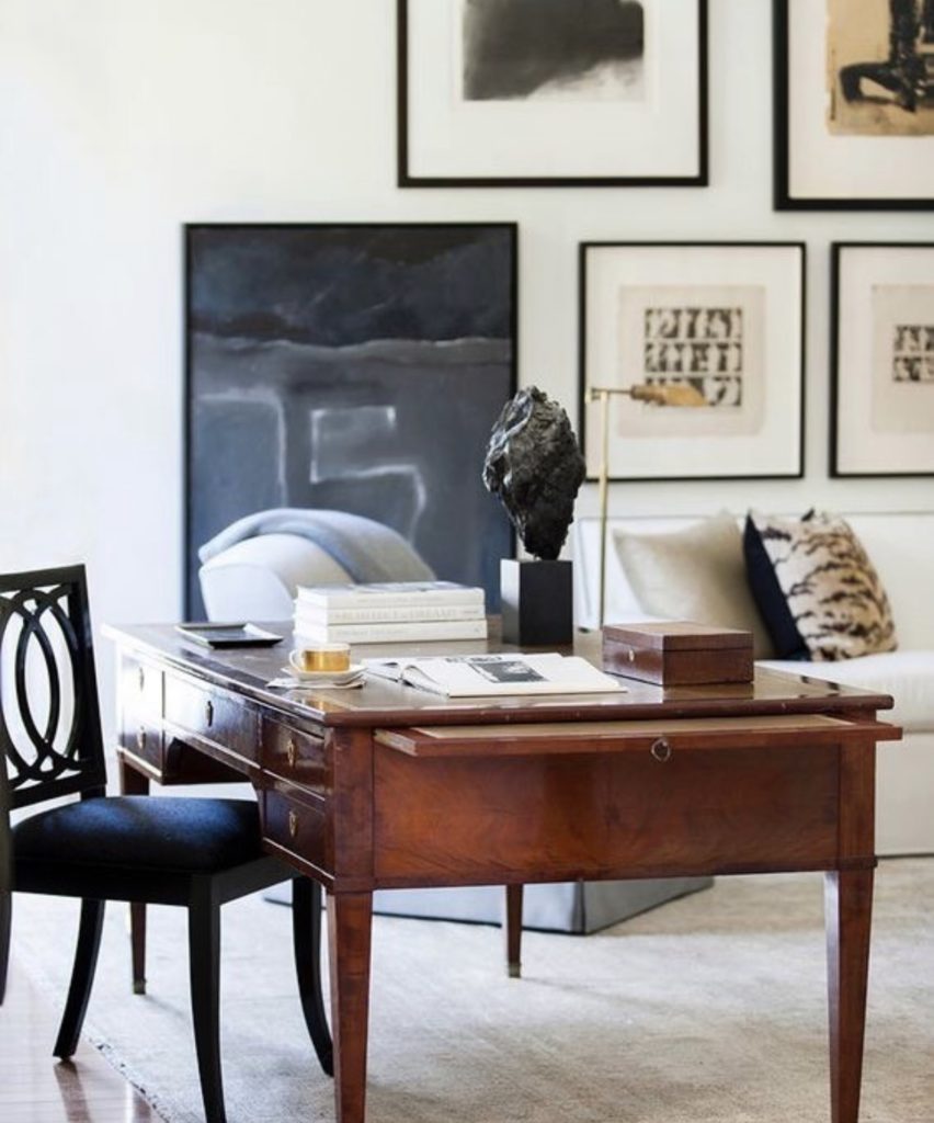 Love this 19th C. French walnut desk paired with a collection of modern art.