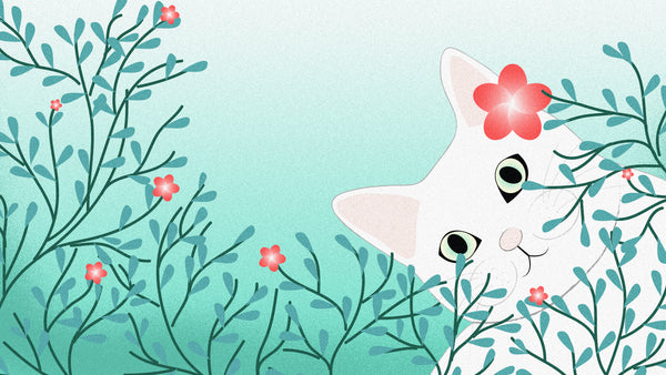 beautiful white cat hiding behind bush with pinkish-red flowers
