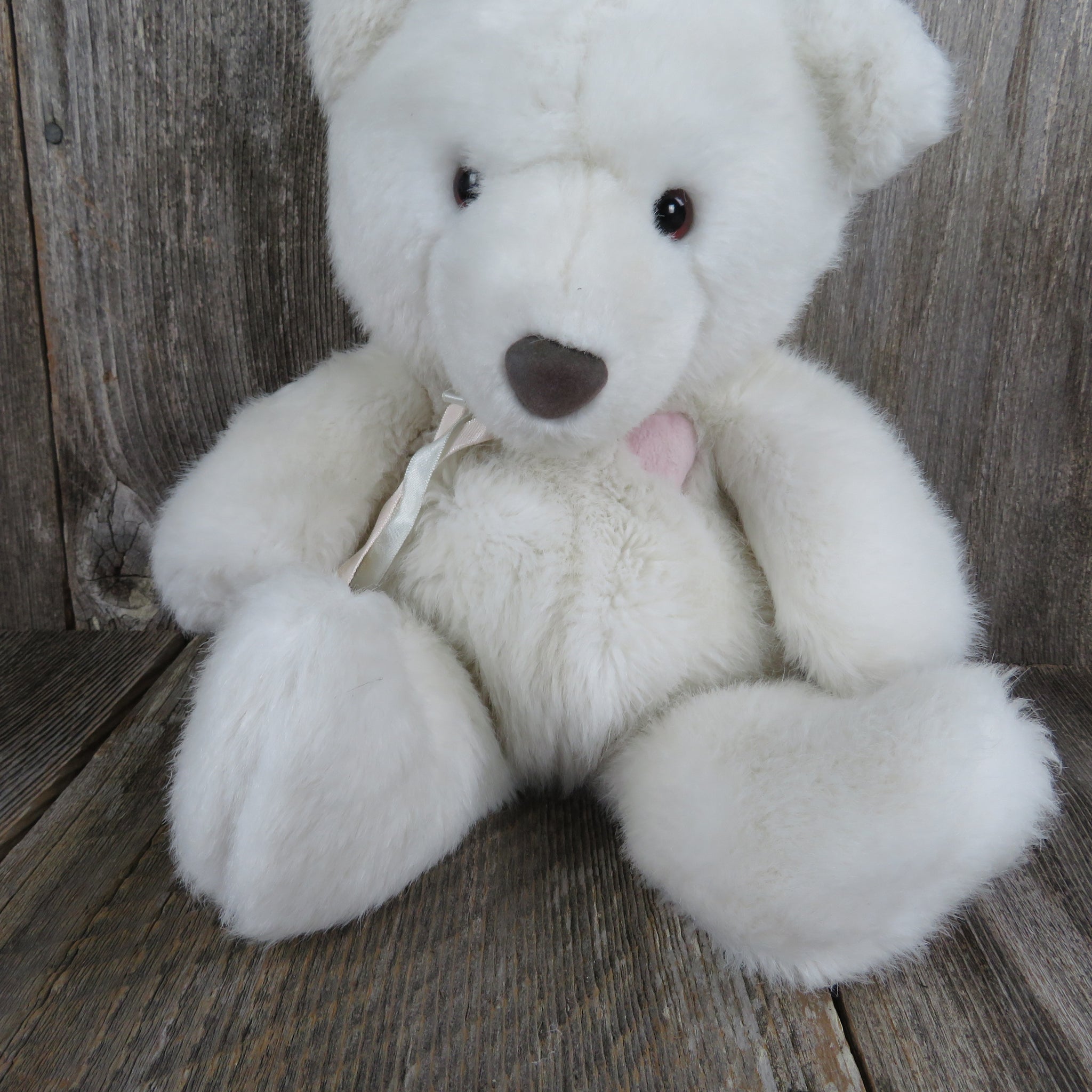 white teddy bear with pink nose